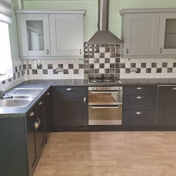 Kitchen respray after - modern two-tone grey finish